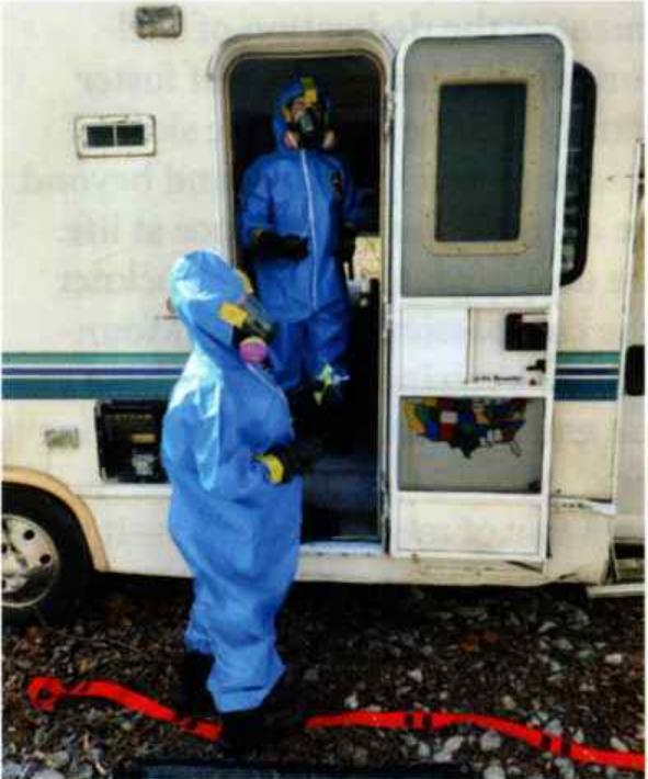 Technicians in protective gear